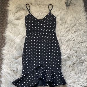 Black fitted dress with white polka dots